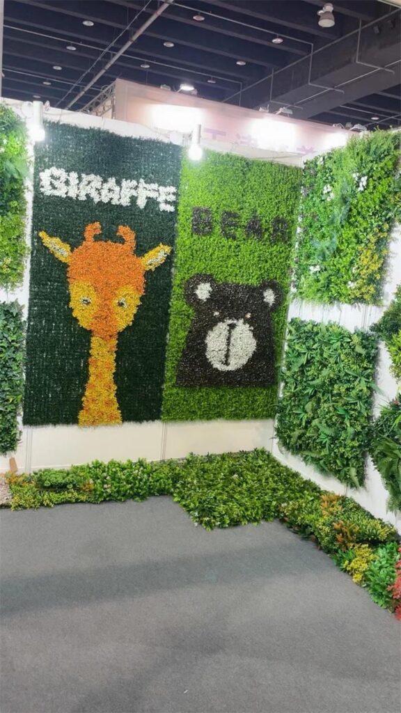 DIY giraffe and bear artificial plant walls at trade show