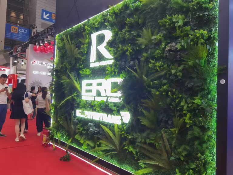 Artificial green walls for trade shows: booth backdrop with backlit brand logo