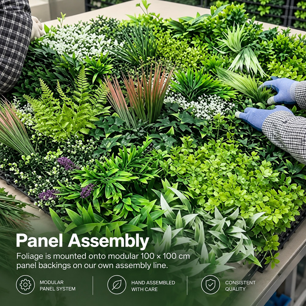 Dense tropical foliage artificial green wall panel assembled on a 100 x 100 cm modular backing