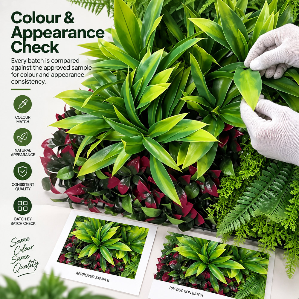 Artificial green wall panel checked for colour and appearance consistency before packing